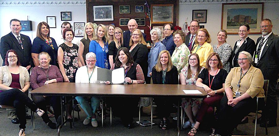 Staff and members of the Area Agency on Aging Advisory Council receive a proclamation for Older Amer