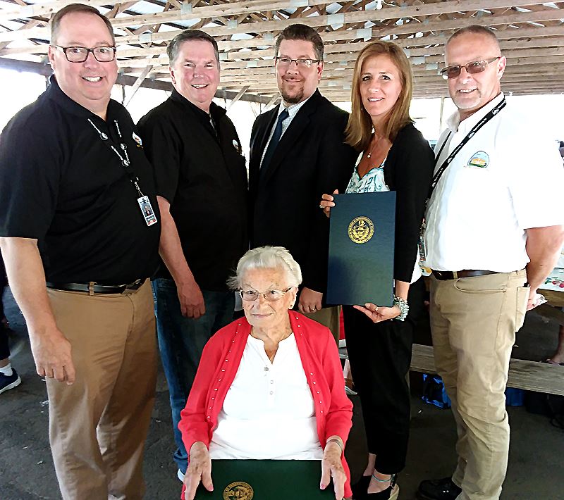 Josephine Tramutola surrounded by the Wayne County Commissioners and other dignitaries.