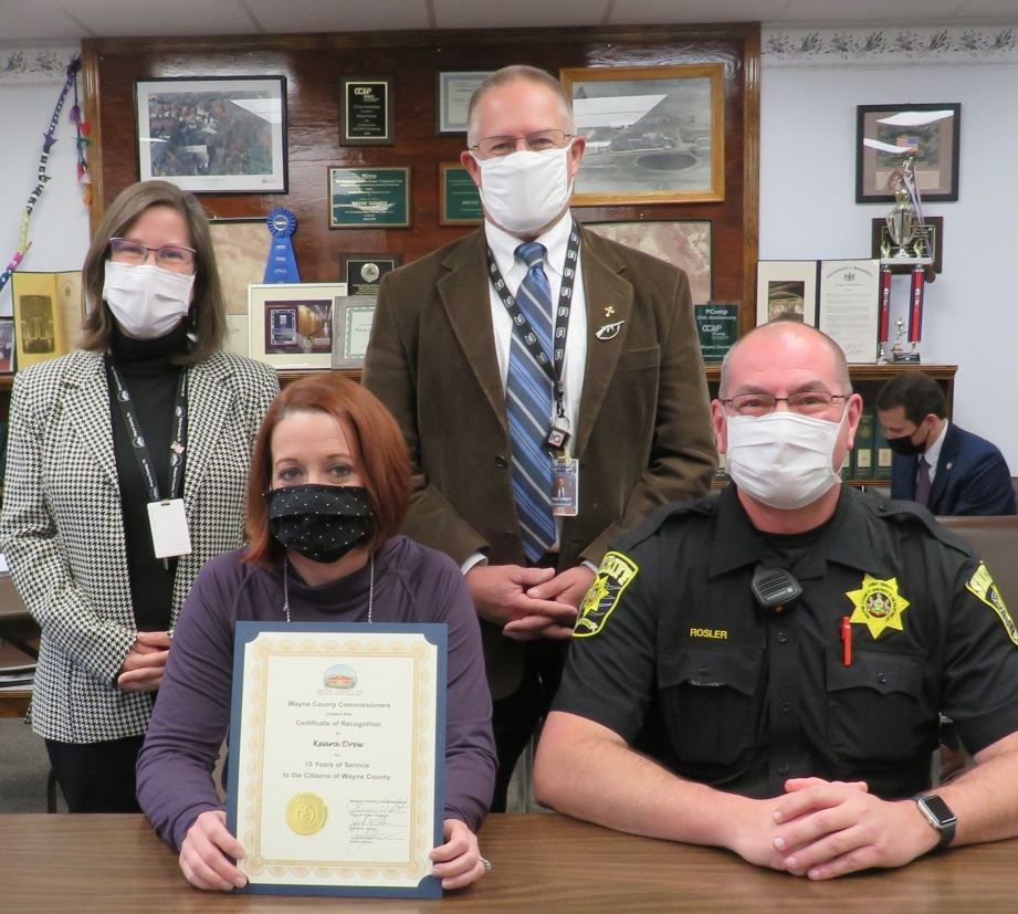 Keara Drew  with the Commissioners marking 10 years of service to the people of Wayne County.