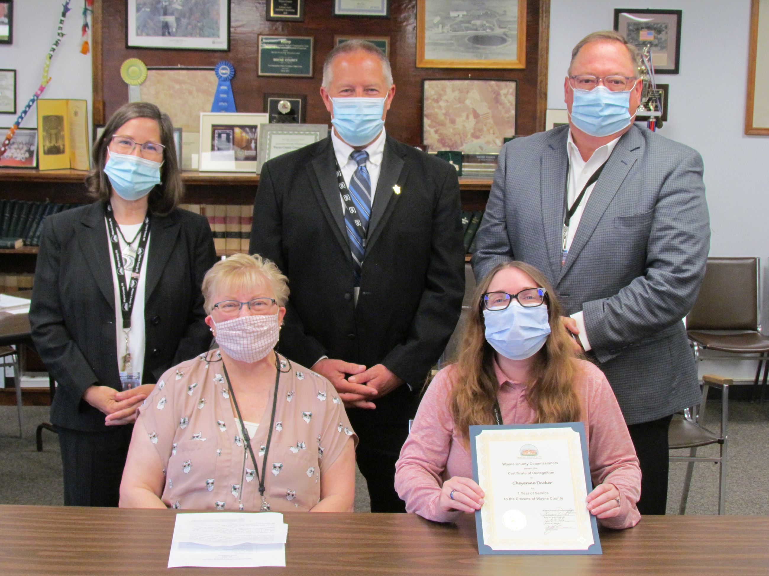 Cheyenne Decker with the Commissioners marking one year of service to the people of Wayne County.